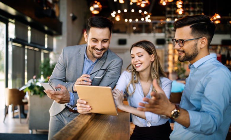 Happy employees discussing their compensation packages