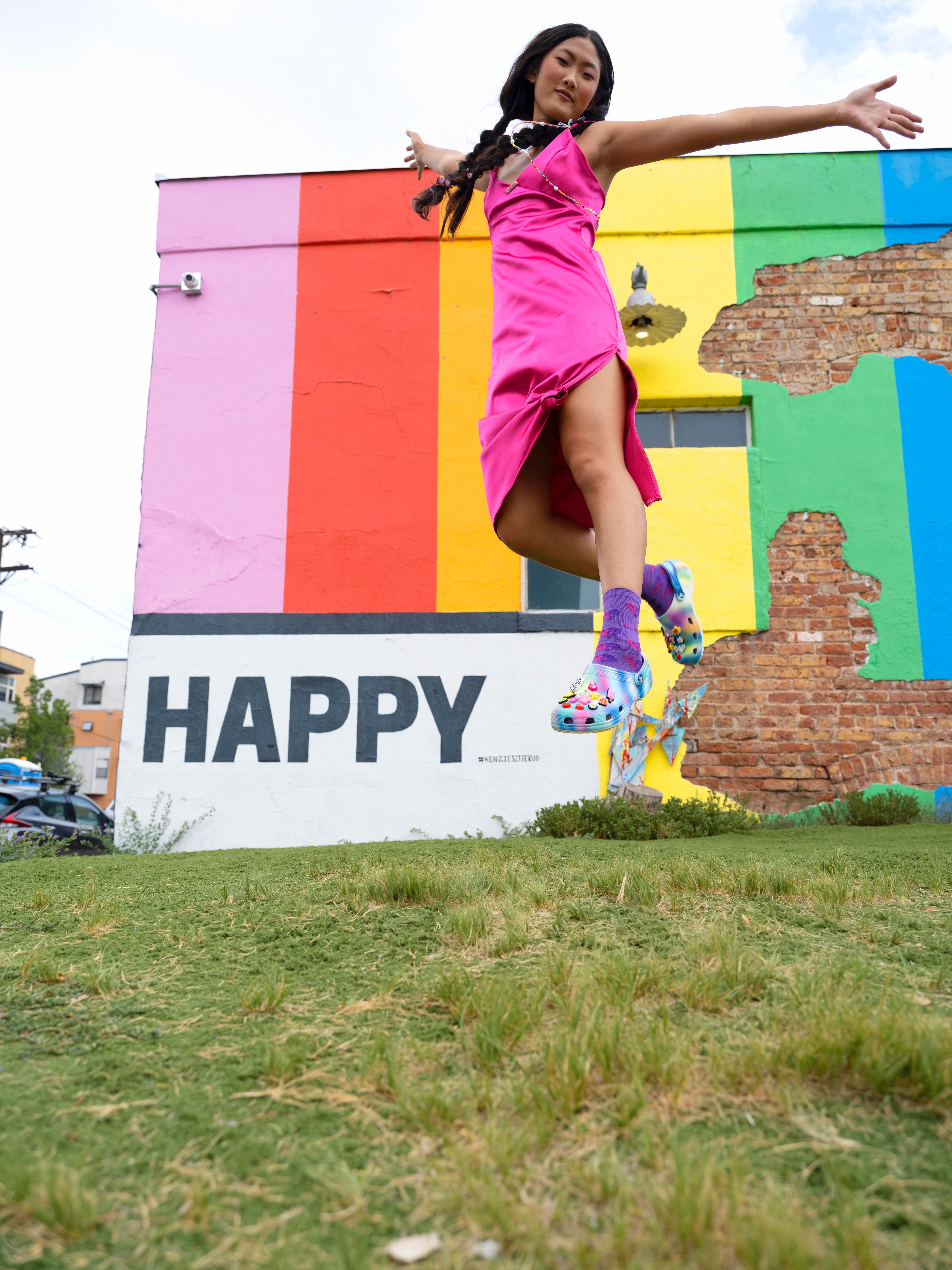 A colorful photo of a woman taking a selfie