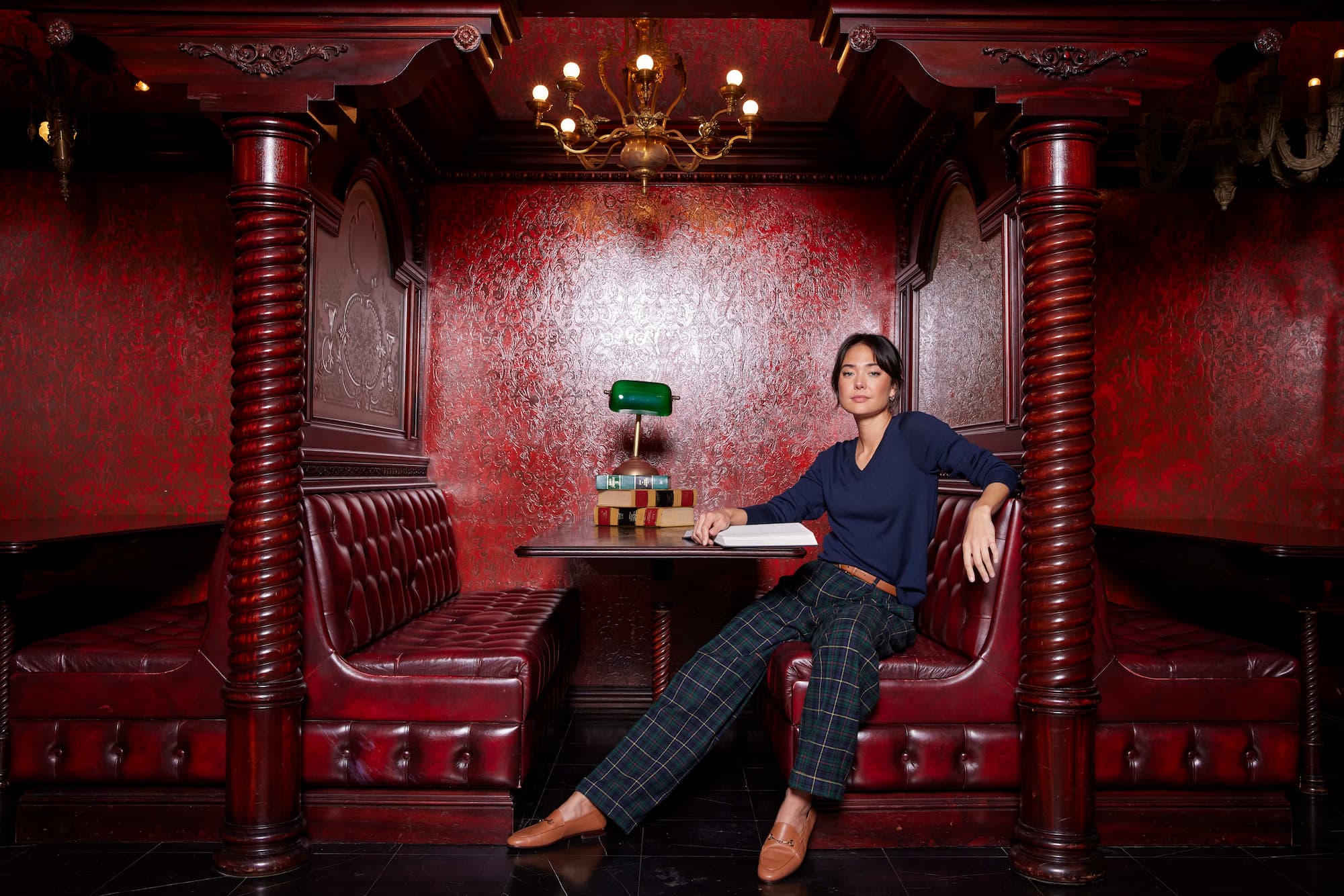 A woman in a red booth