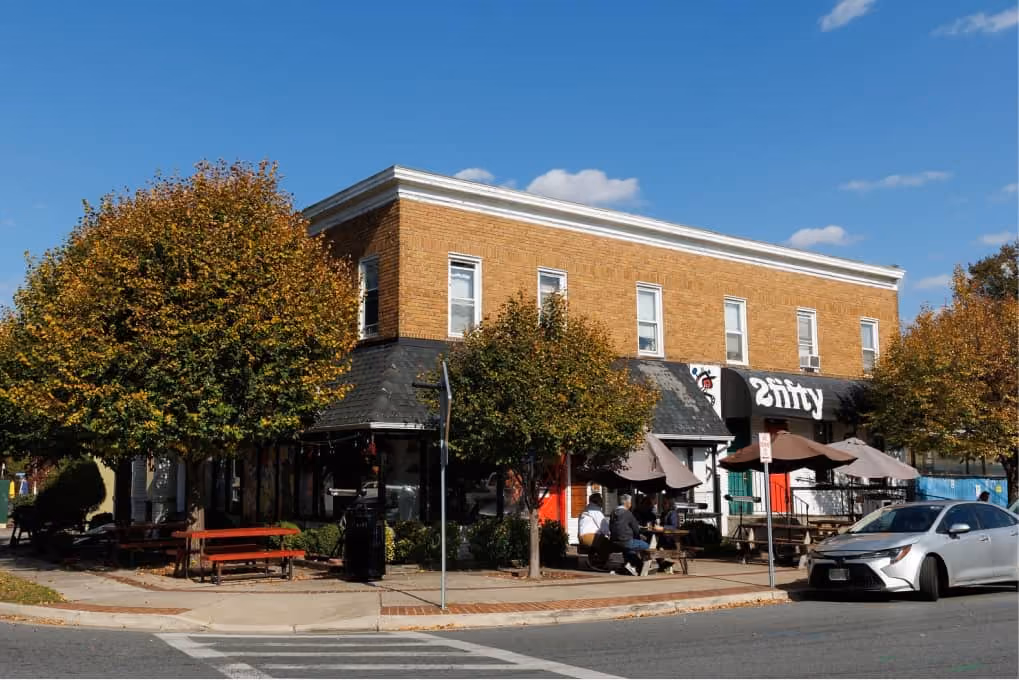 2Fifty BBQ Riverdale exterior with patio seating on sunny corner, wood-smoked barbecue restaurant
