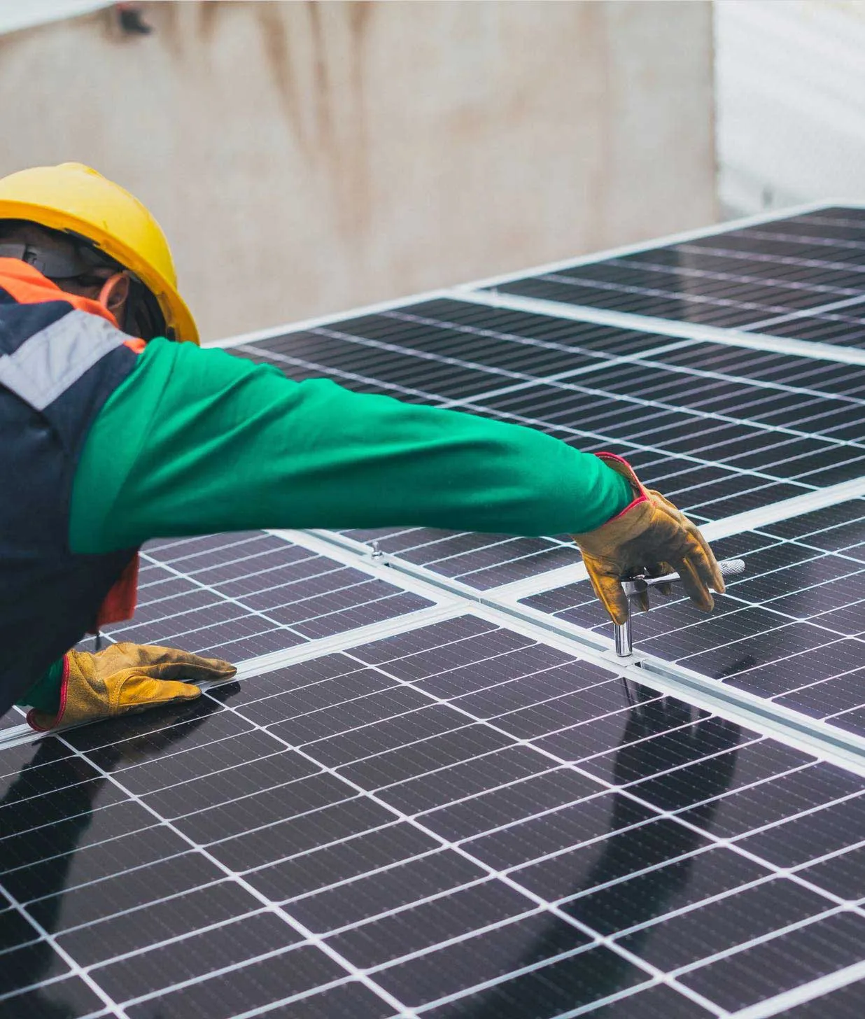 worker installing solar panel