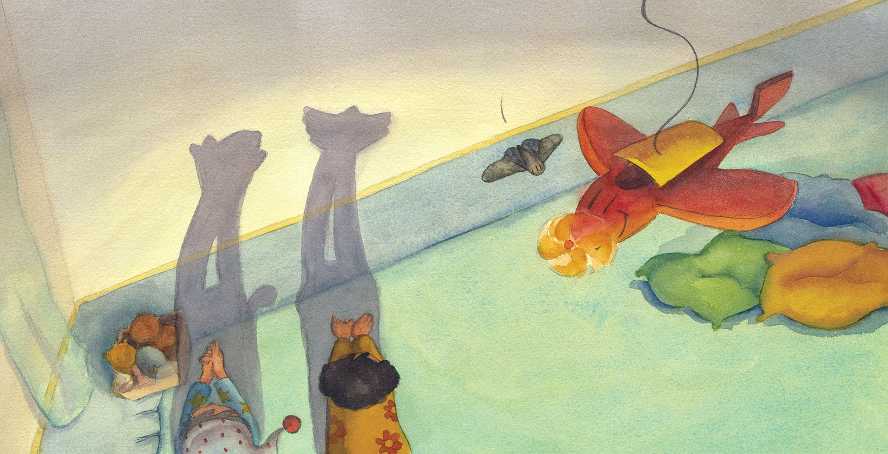 Watercolor illustration of two children lying face down on the floor casting shadows resembling animals, with a toy airplane and cushions nearby.