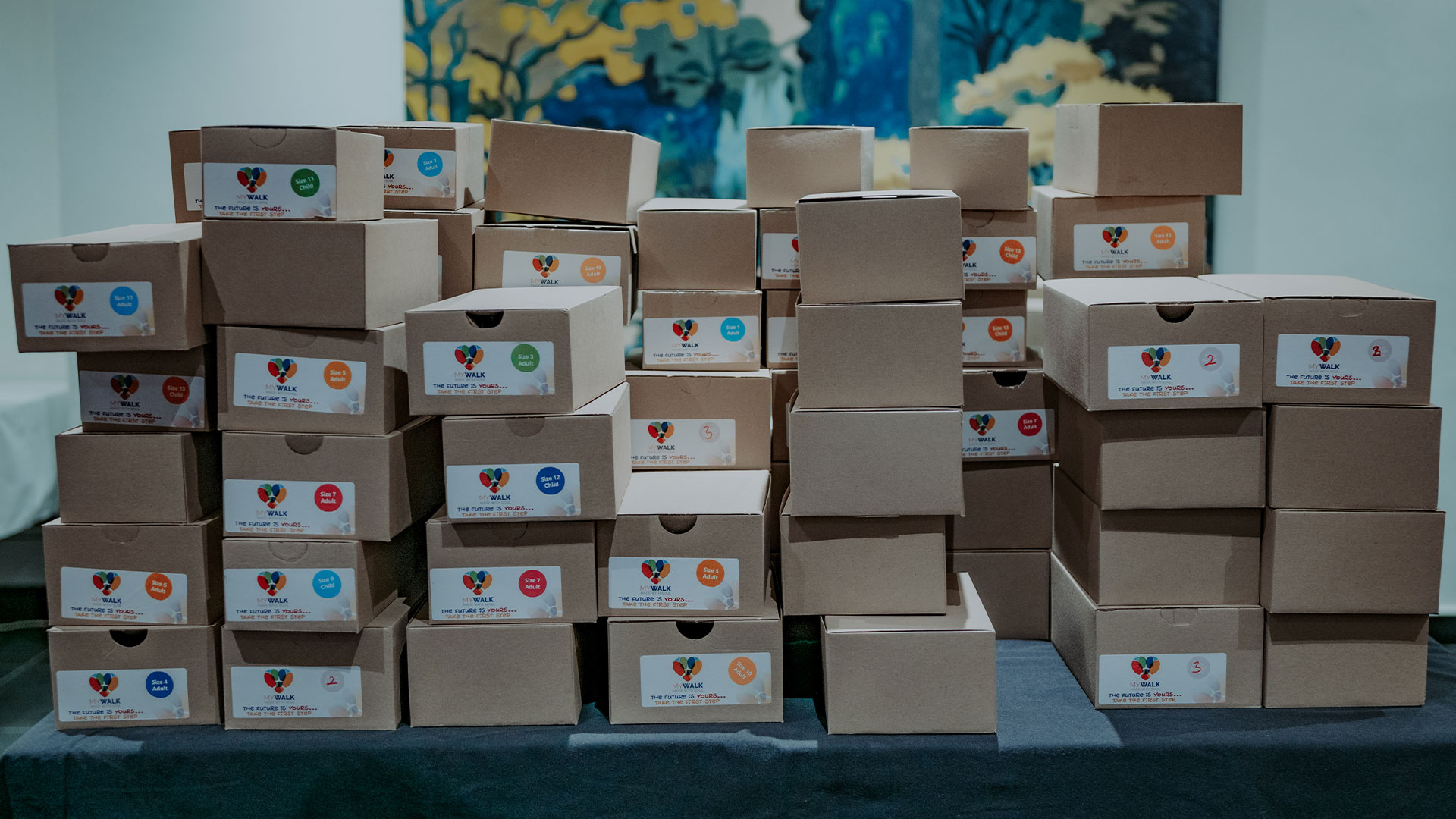 Large stack of school shoe boxes ready for donating.