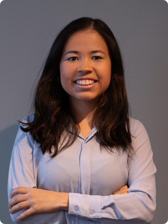 A woman with long hair and a blue shirt.