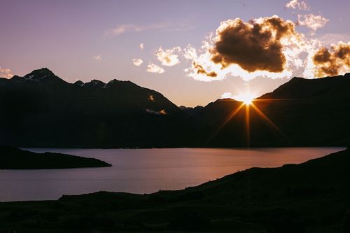 Sunset over mountain and lake