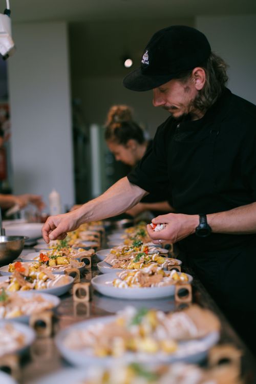 a chef plates food for a retreat lunch