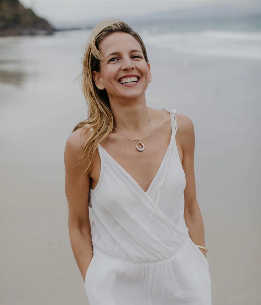 A woman smiles for a portrait