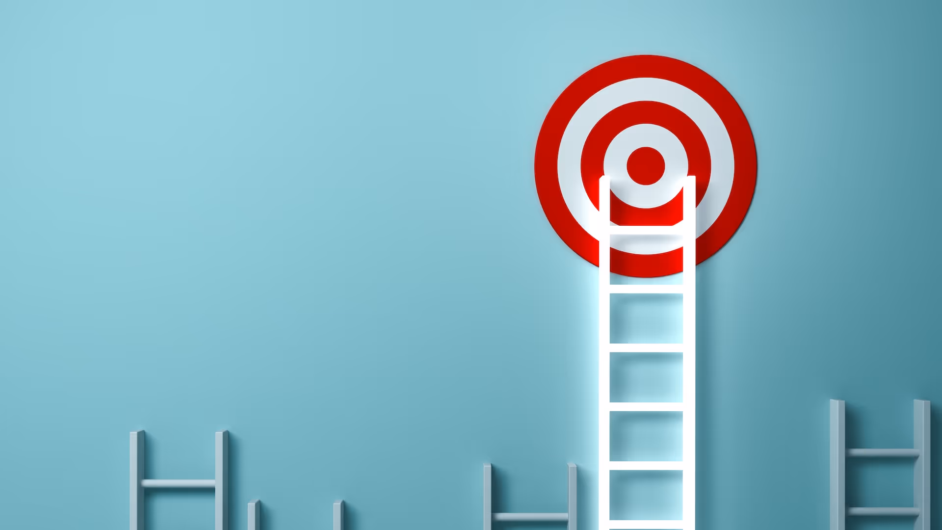 target on a wall with a ladder rising above the rest to meet it