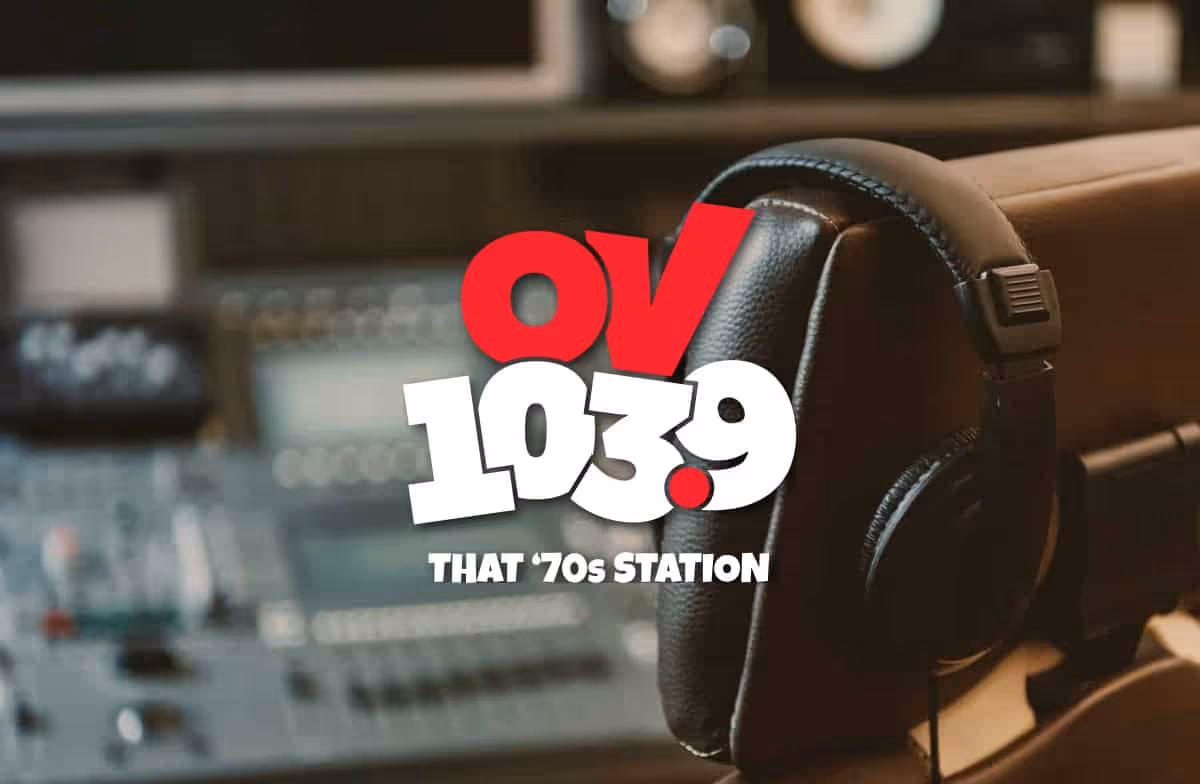 radio station logo set over top of a chair and sound console in a radio booth