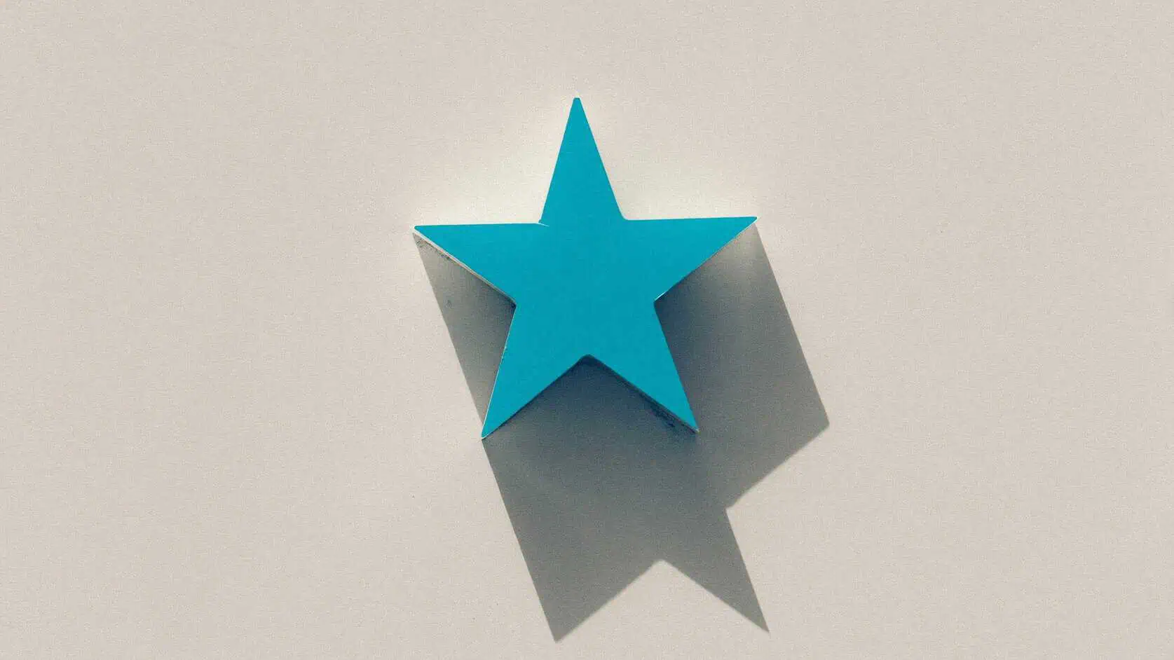 A single blue star displayed against a white backdrop.