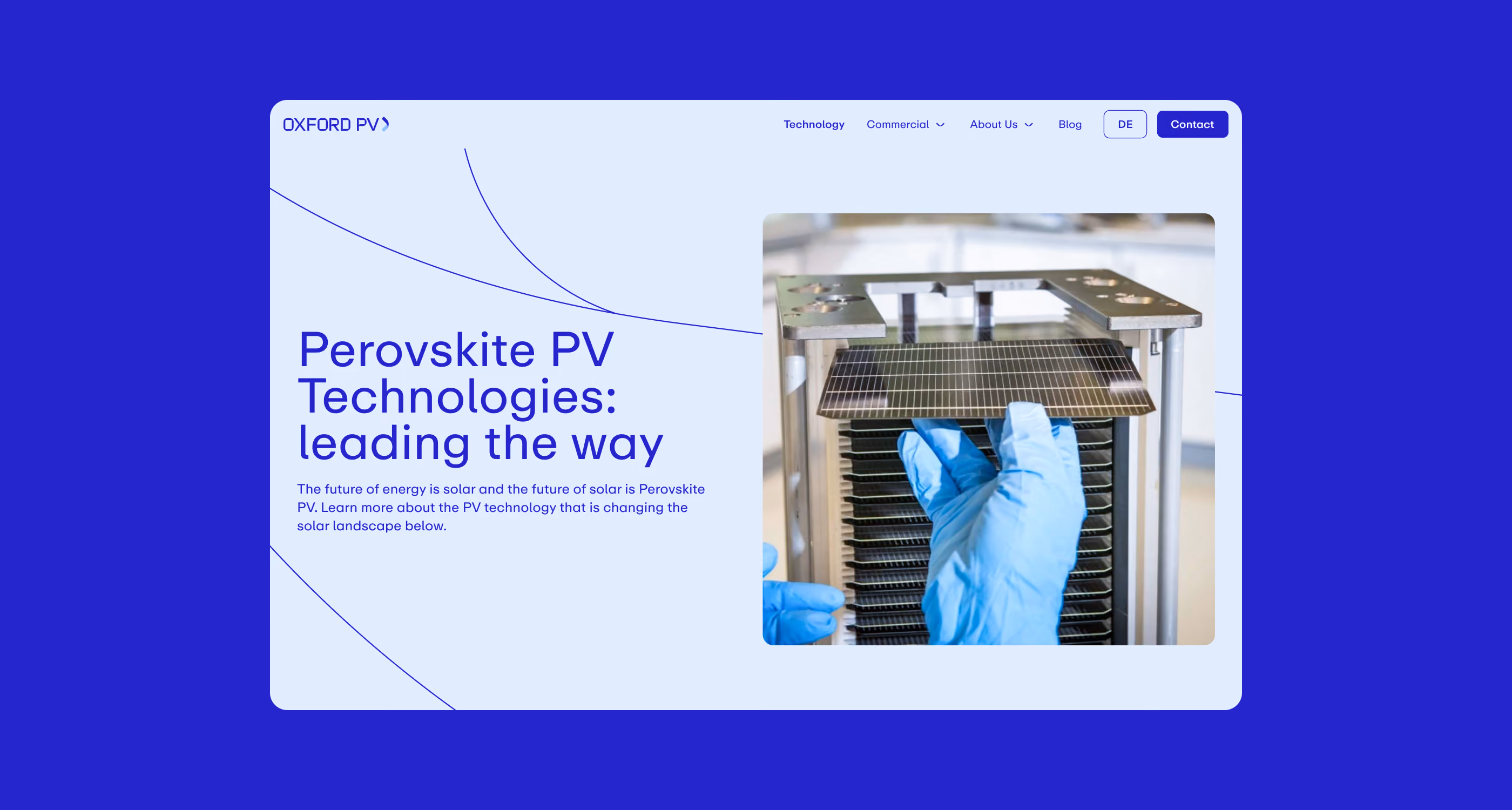 Hand in blue glove holding a solar panel from a stack of panels inside a metal frame.