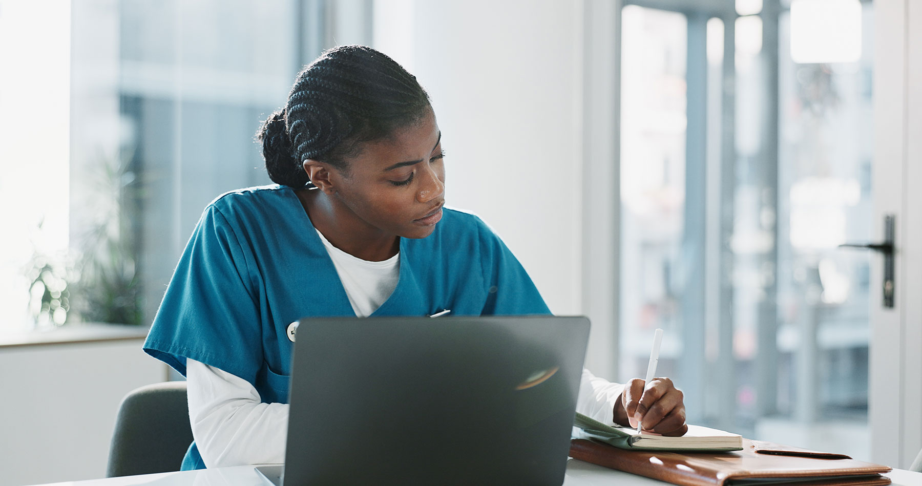 Nurse working on laptop