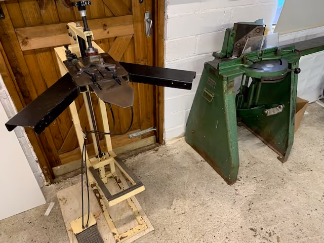 Underpinner and mitre guillotine in the EMEU framing workshop