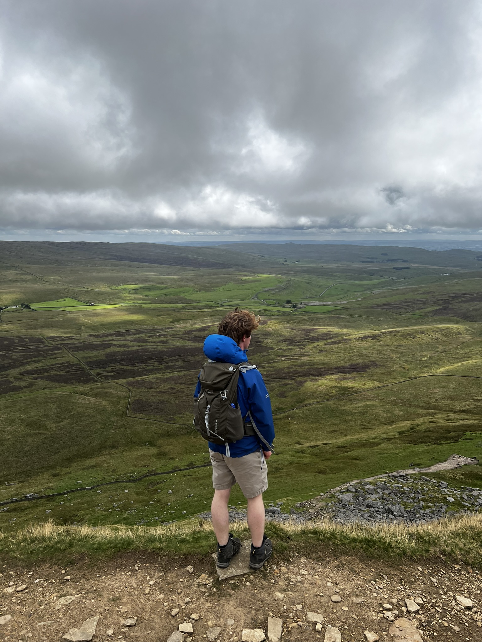 A hiker on Pen-y-Ghent in Ribblesdale, Yorkshire Dales