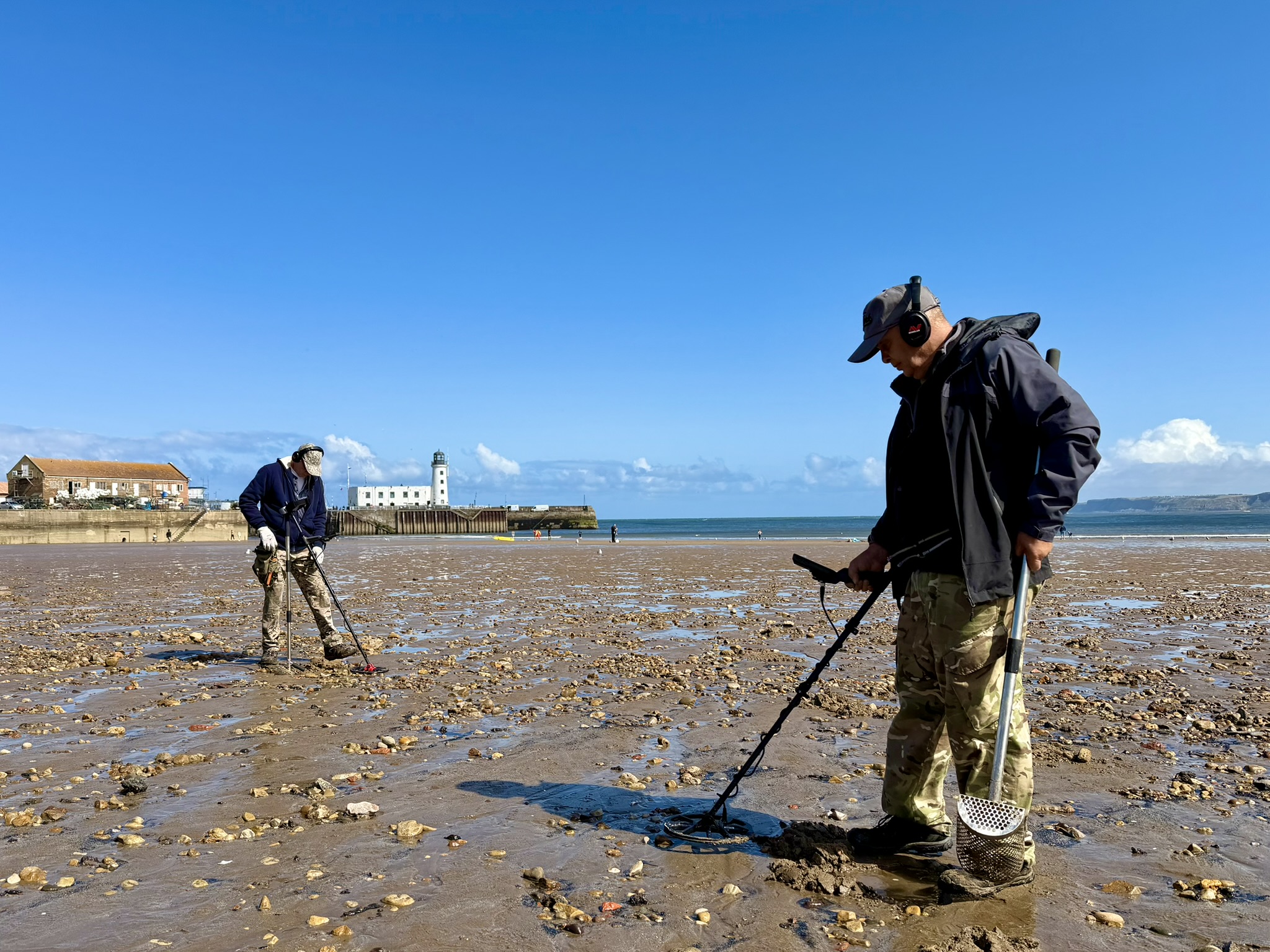 Detectorists Brian and John searching South Bay at low tide