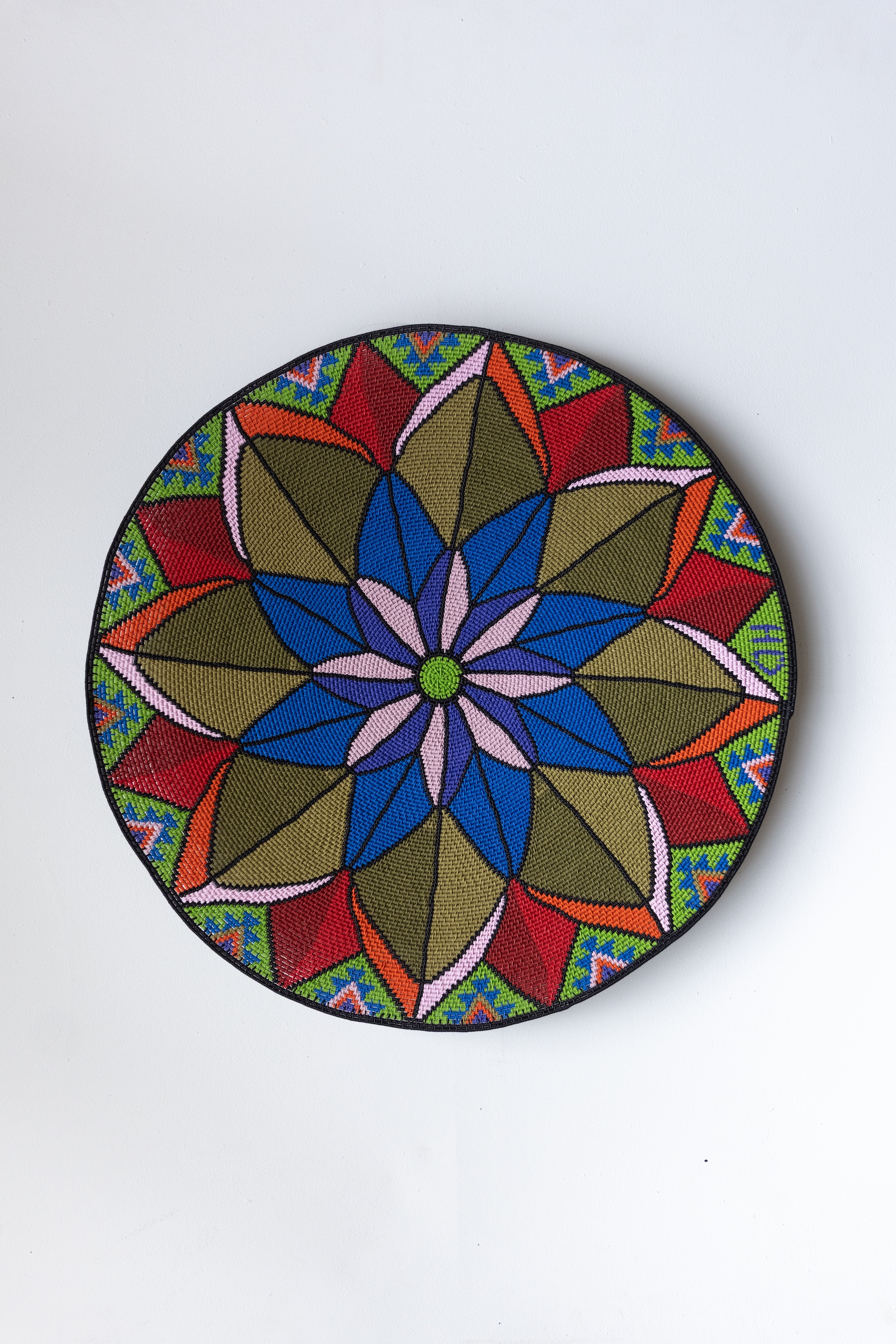 Woven with multicoloured geometric pattern, 50cm diameter, 2025