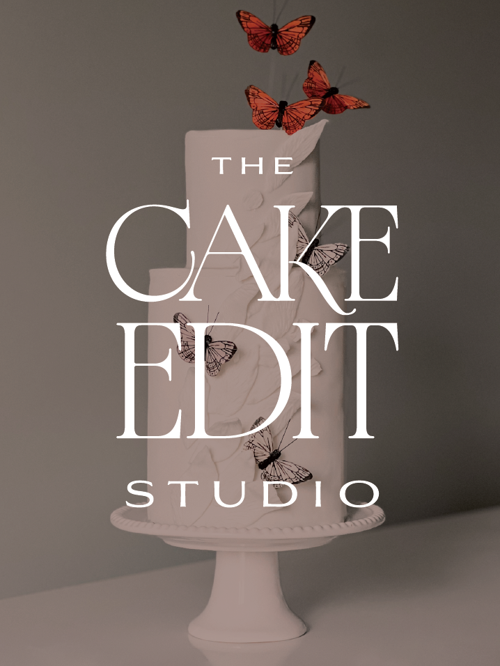 Two-tier white cake on a pedestal with orange and black butterflies, overlaid with The Cake Edit Studio text.
