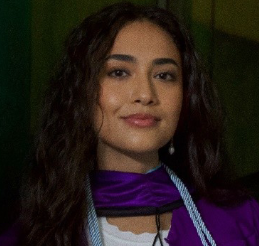 Ms. Cory Livecchi wearing purple graduation stole