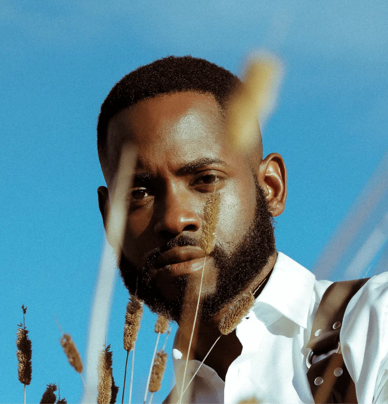 a man with a beard and a white shirt