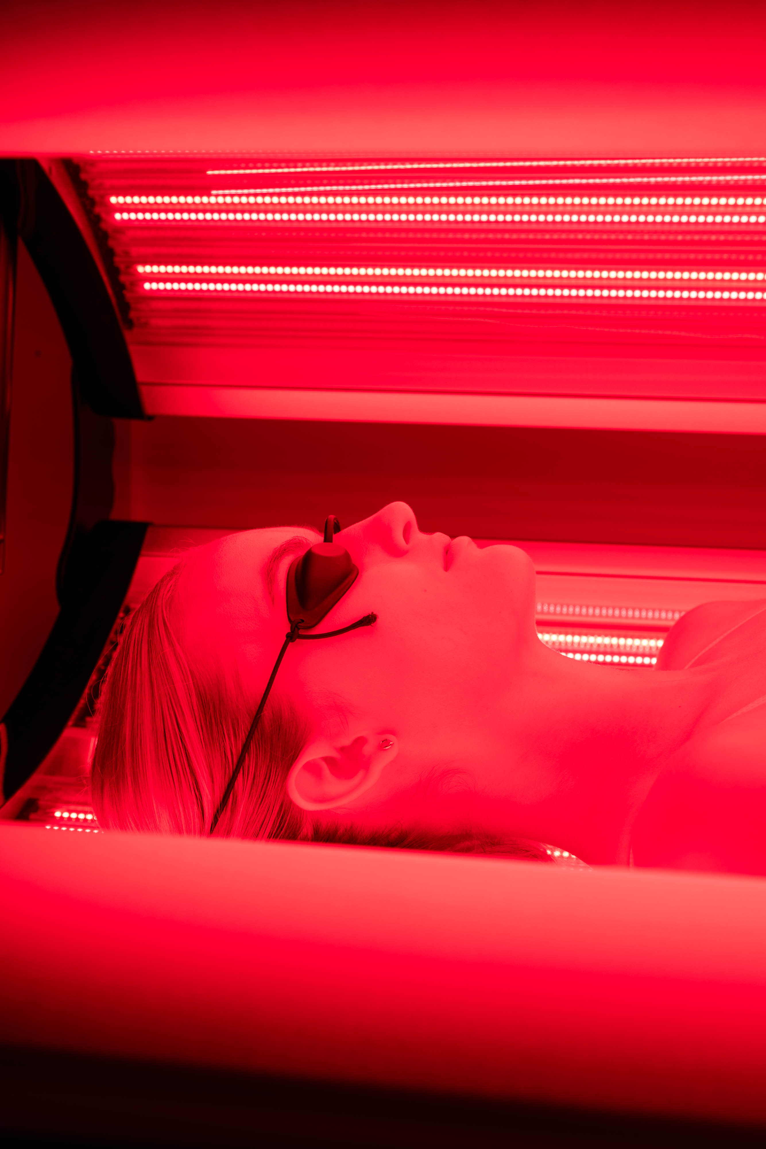 Face Of Female In Red Light Therapy Bed - Breathe WRL