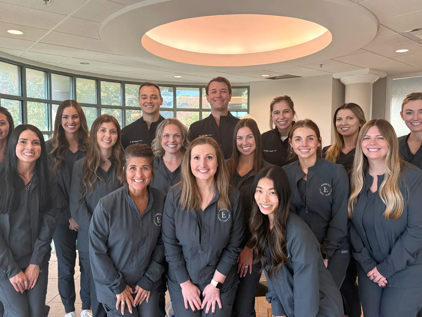 A group of doctors standing in a room.
