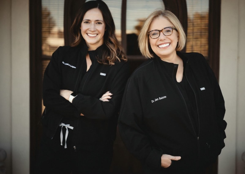 Two female dental professionals in office setting, representing trusted family dental care team