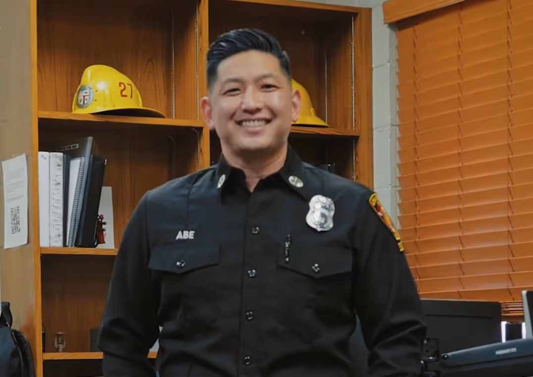 Captain Abe smiling in his office, well he explains his job as a captain.