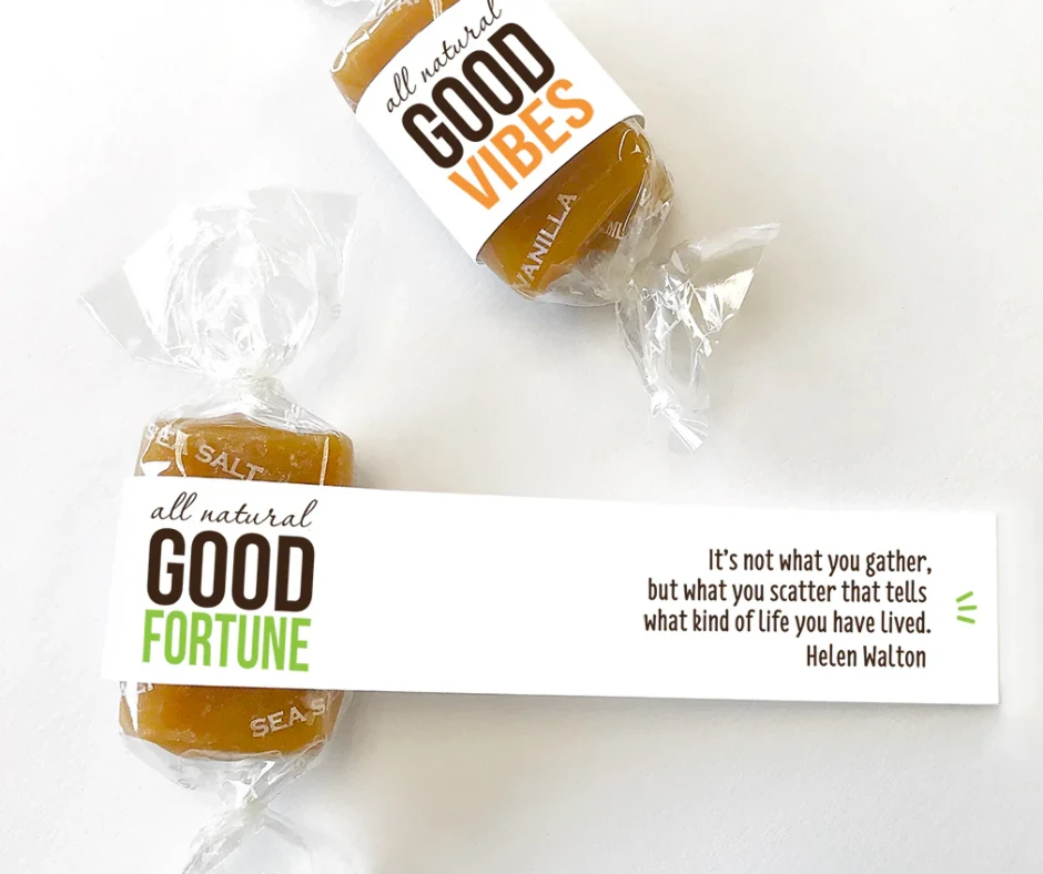 Two wrapped caramels labeled Good Vibes and Good Fortune with a Helen Walton quote on a white strip.