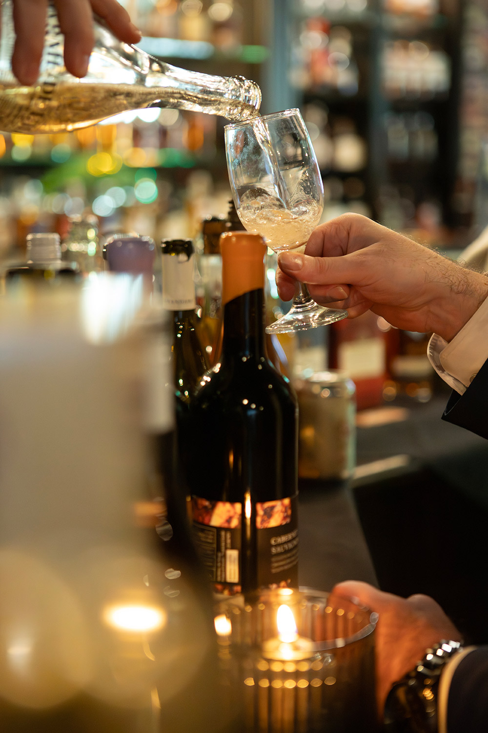 A closeup photo of wine being poured at the gala event