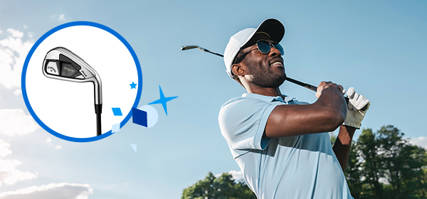 A man finishing his golf stroke, following the ball through the air.