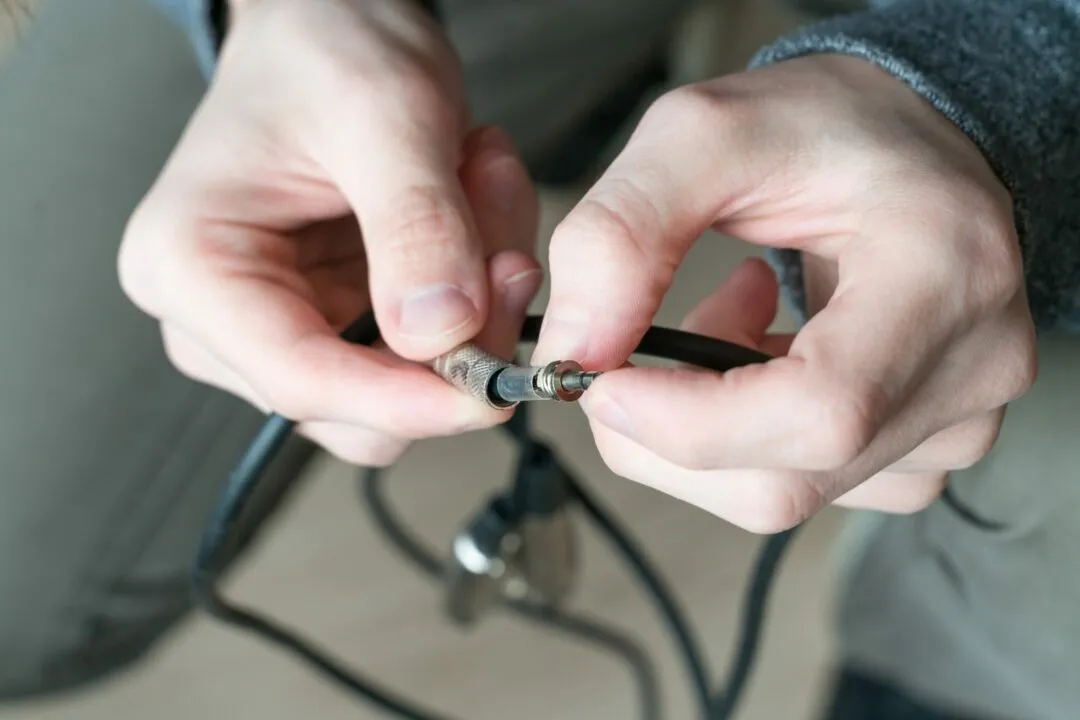 Electrical wires in male hands