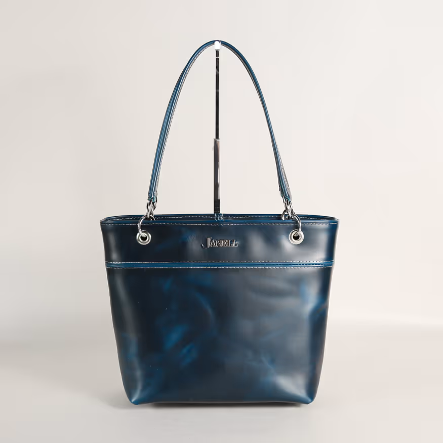 a lady holds hand crafted leather clutches