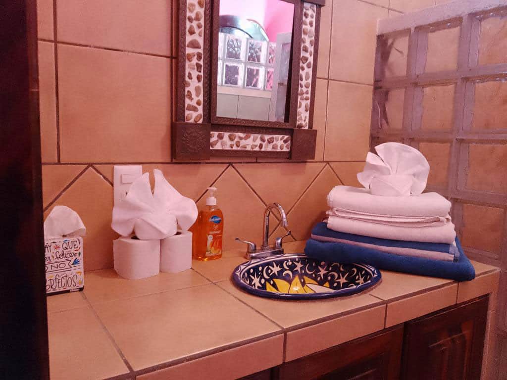 Bathroom sink with towels.