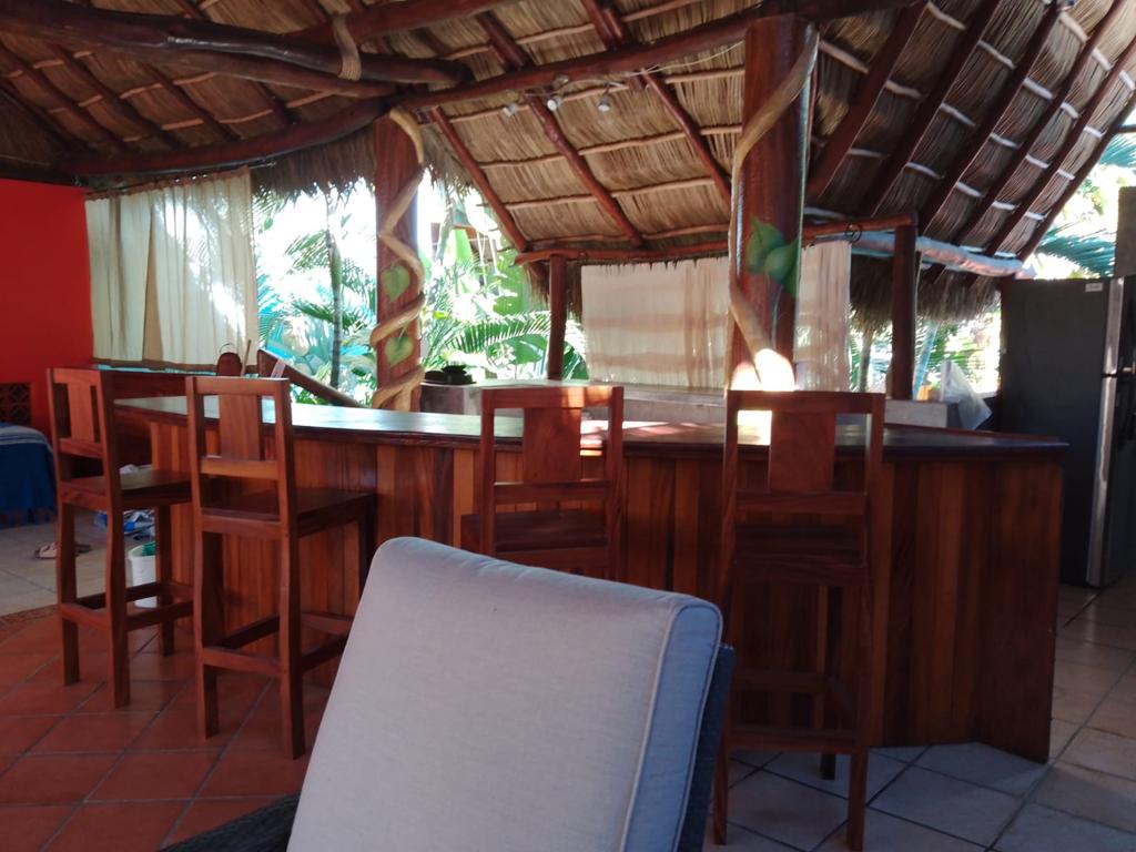 Second floor curved bar with stools.