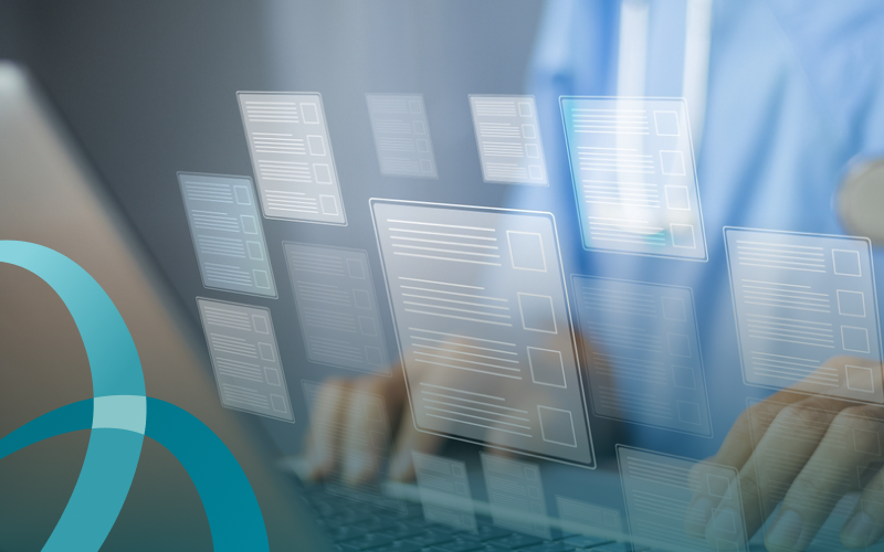 a nurse at a laptop sees a host of document and app icons hovering over the keyboard.