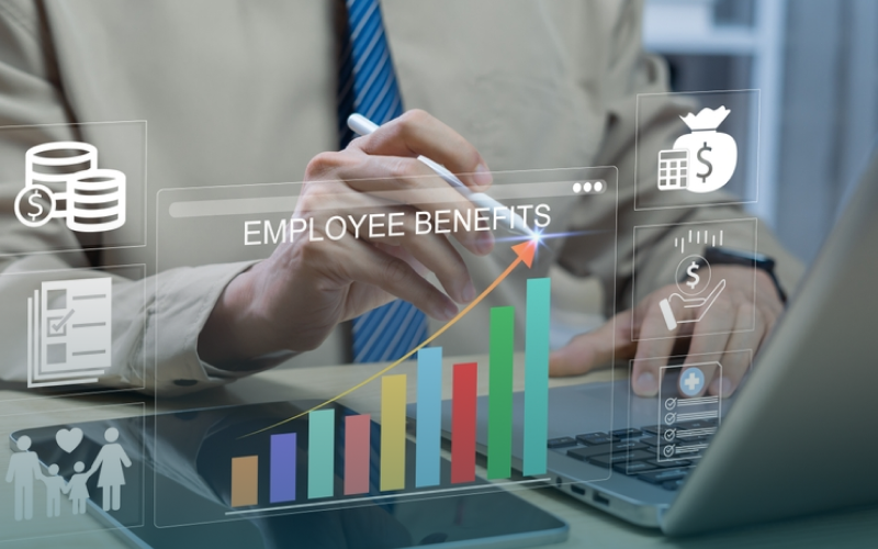 Professional at a laptop interacts with virtual pop up UX elements.