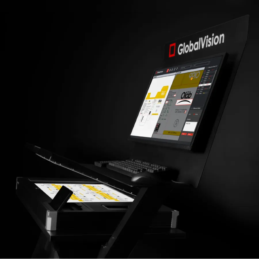 A sleek workstation featuring a monitor displaying software with colorful graphics, alongside a scanning surface and keyboard.