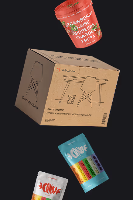 Cardboard GlobalVision PrecisionDesk box with chair illustration and text 'Chair not included,' surrounded by colorful strawberry and candy-flavored product packages.