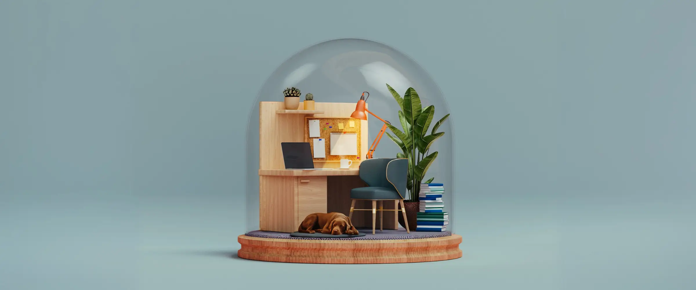 Miniature cozy home office setup with a wooden desk, laptop, orange desk lamp, chair, plant, stacked books, and a sleeping brown dog under glass dome.