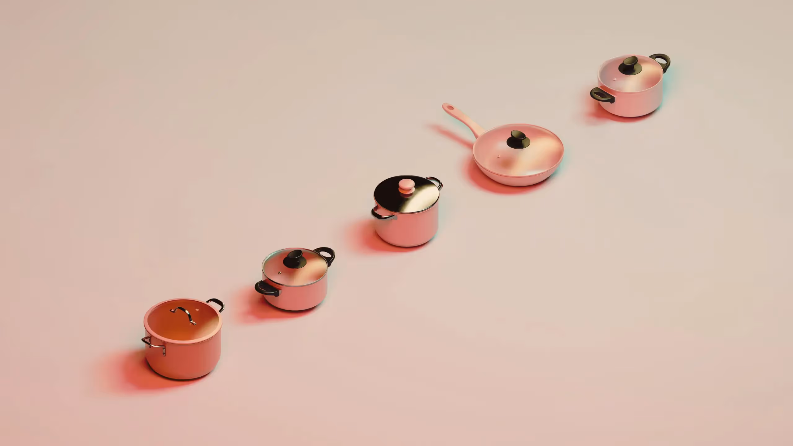 A line of cooking pots and pans in differing shades of peach.