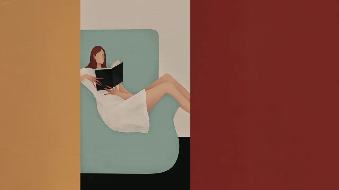 Looking through a doorway at a woman in a white dress sitting comfortably across an armchair, reading a book.