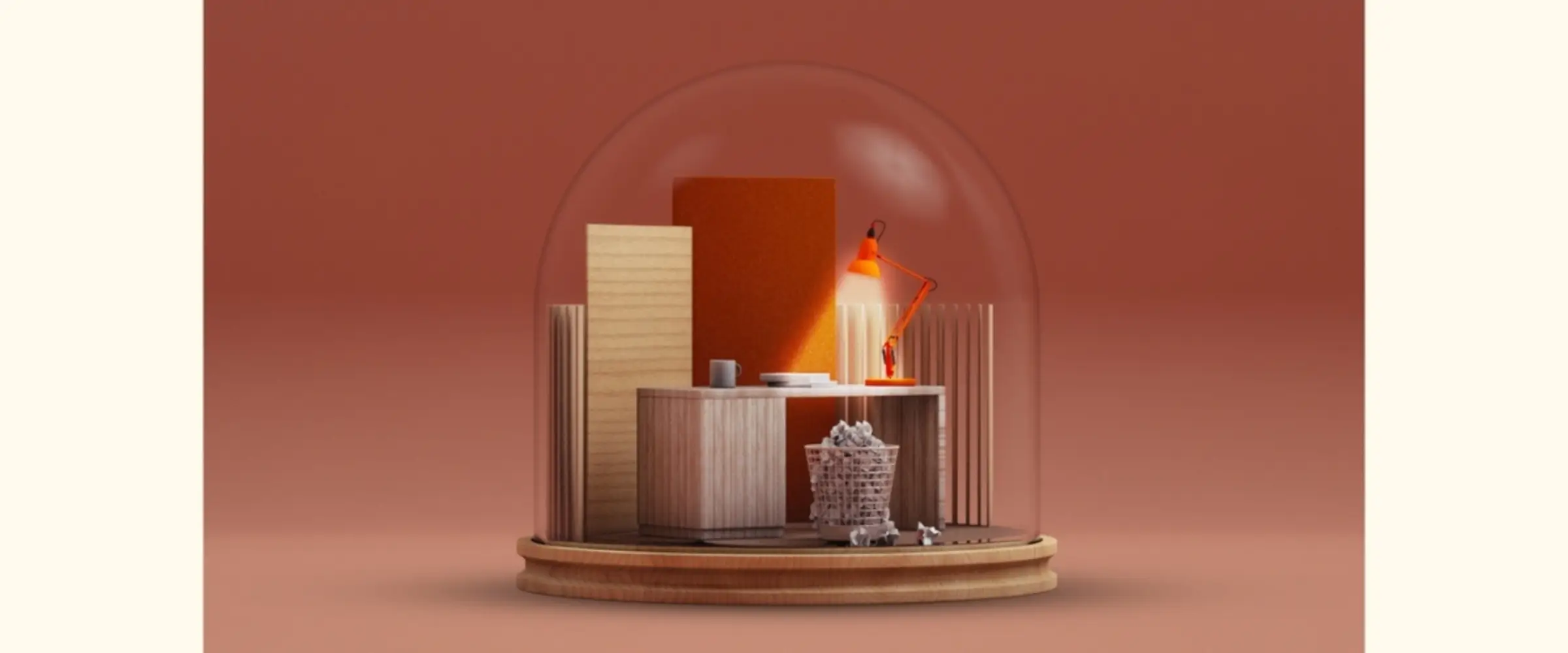 A graphic snowglobe containing a desk lit by an orange lamp and a full wastepaper bin.