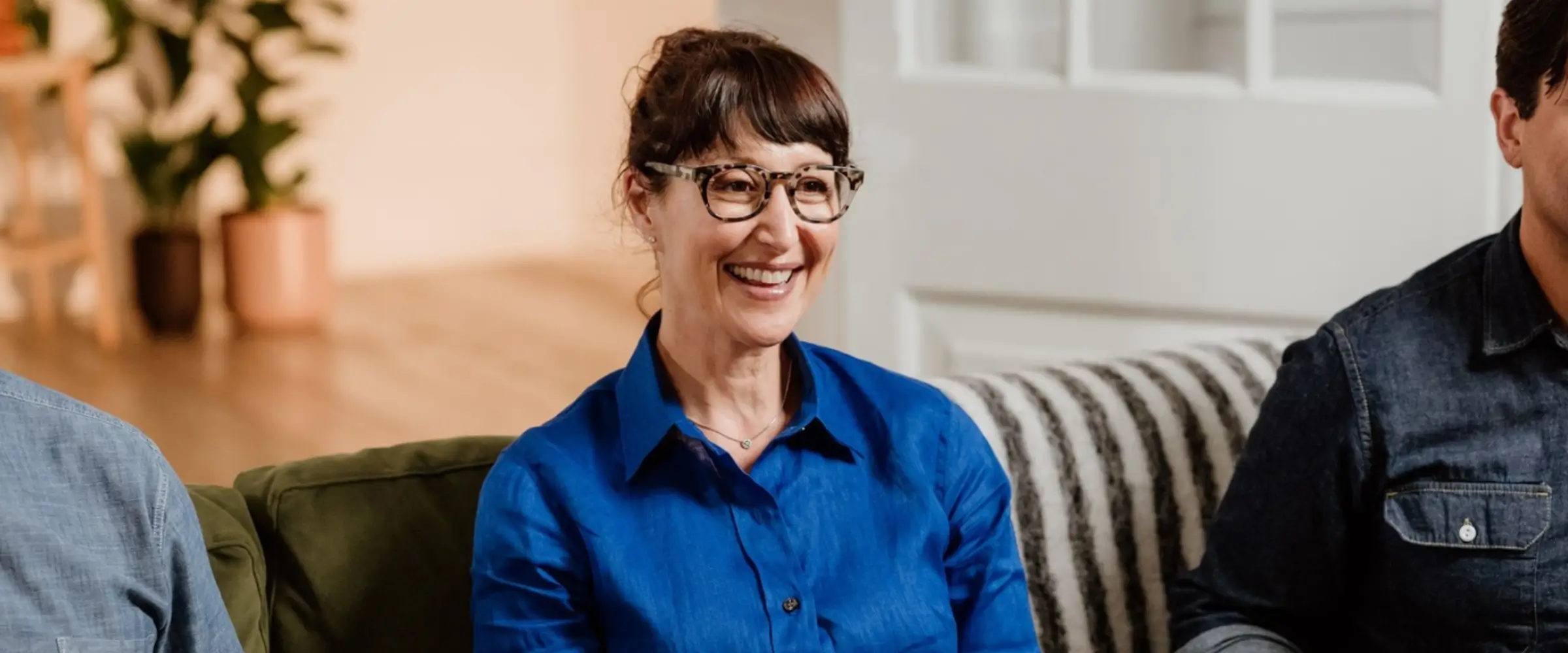Author Gina Sorell smiling wearing a blue shirt at The Novelry
