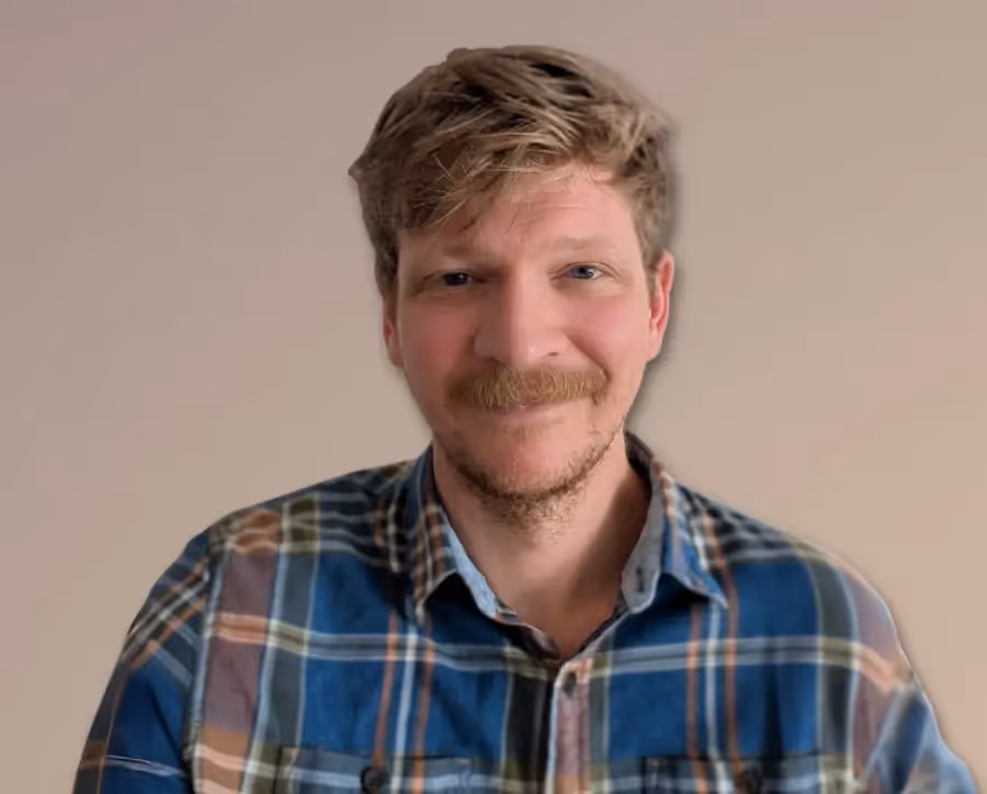 Portrait headshot image of the author and writing coach Ian Green.