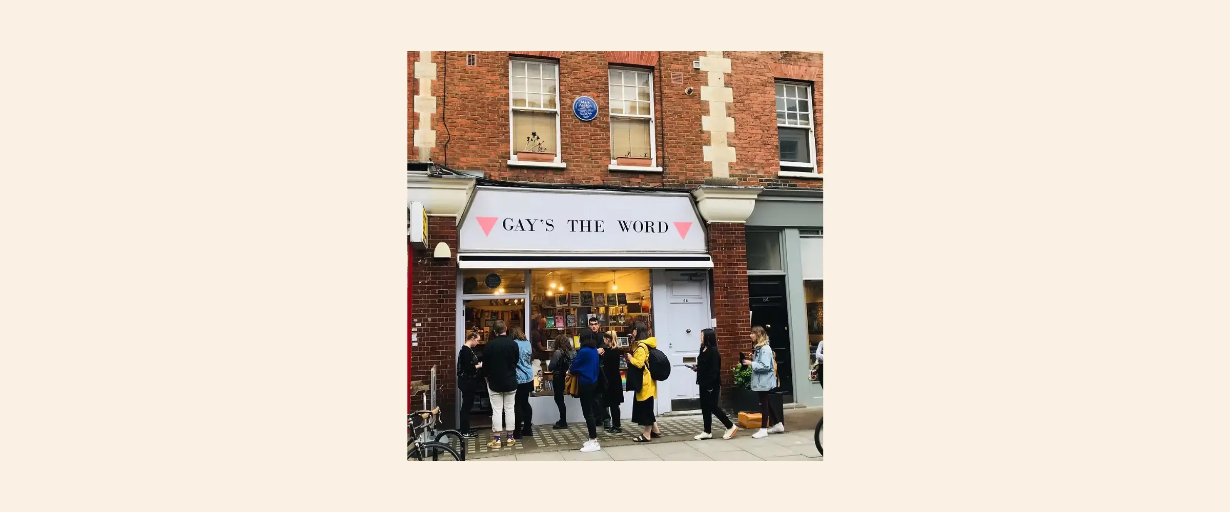Exterior shot of Gay's The Word bookshop, London, outside which customers are gathered.
