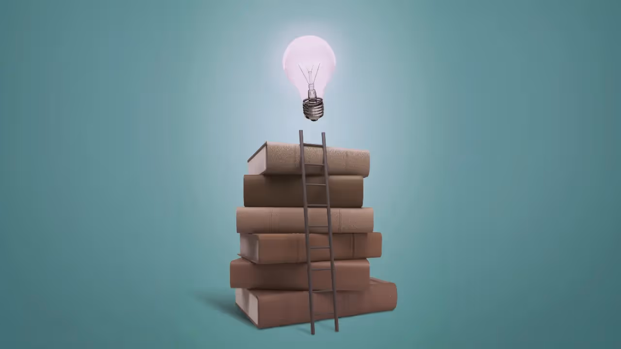 A stack of books with a ladder propped up against it, and a lightbulb at the very top.