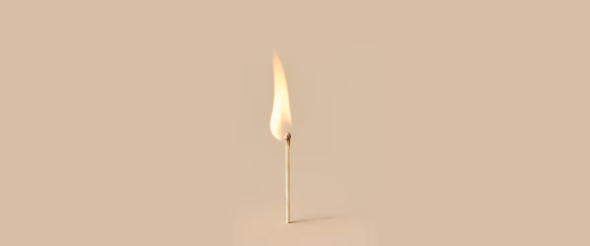 A lit match stands alone.