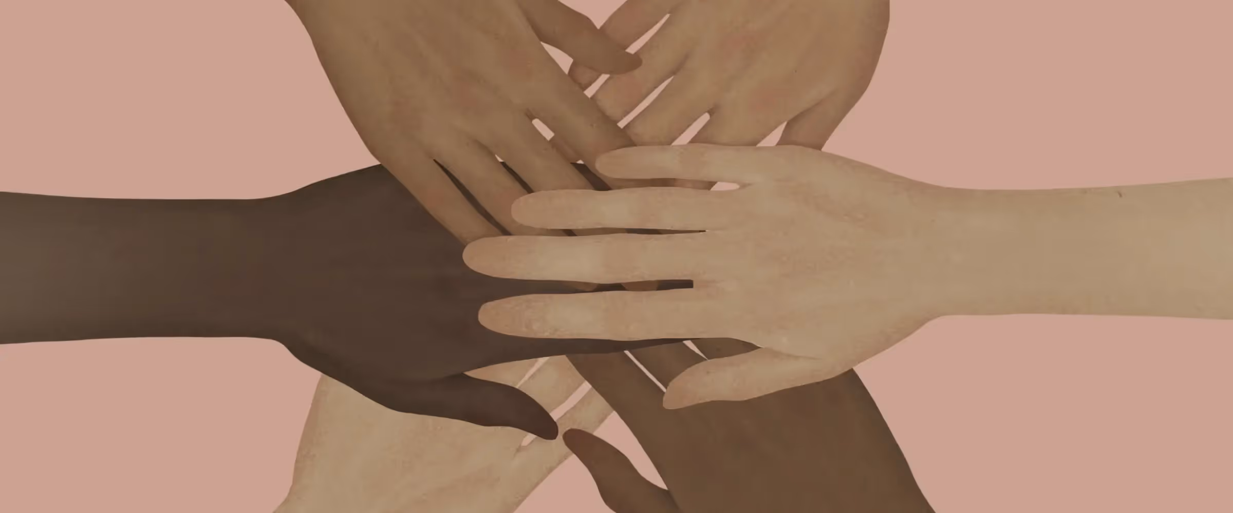 Hands of different skintones stack over each other as if to suggest teamwork.