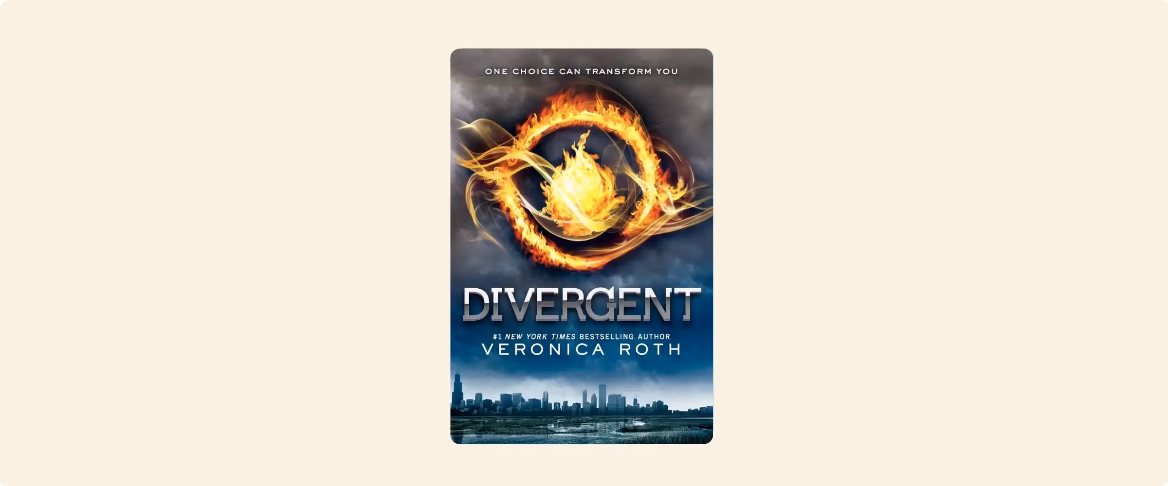 A book cover for Divergent, showing a city and a fiery emblem.