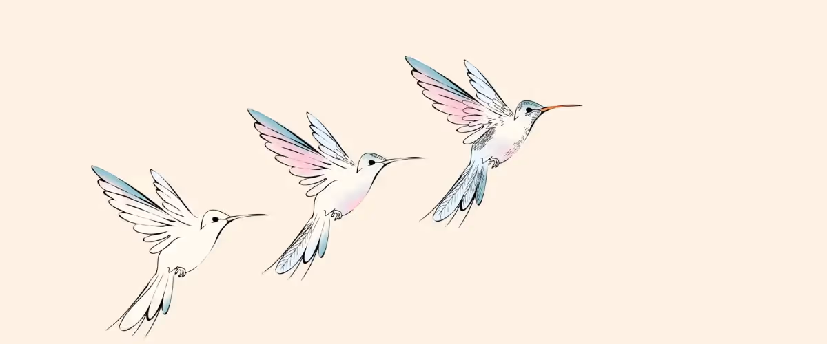 Three birds are flying off into the distance.
